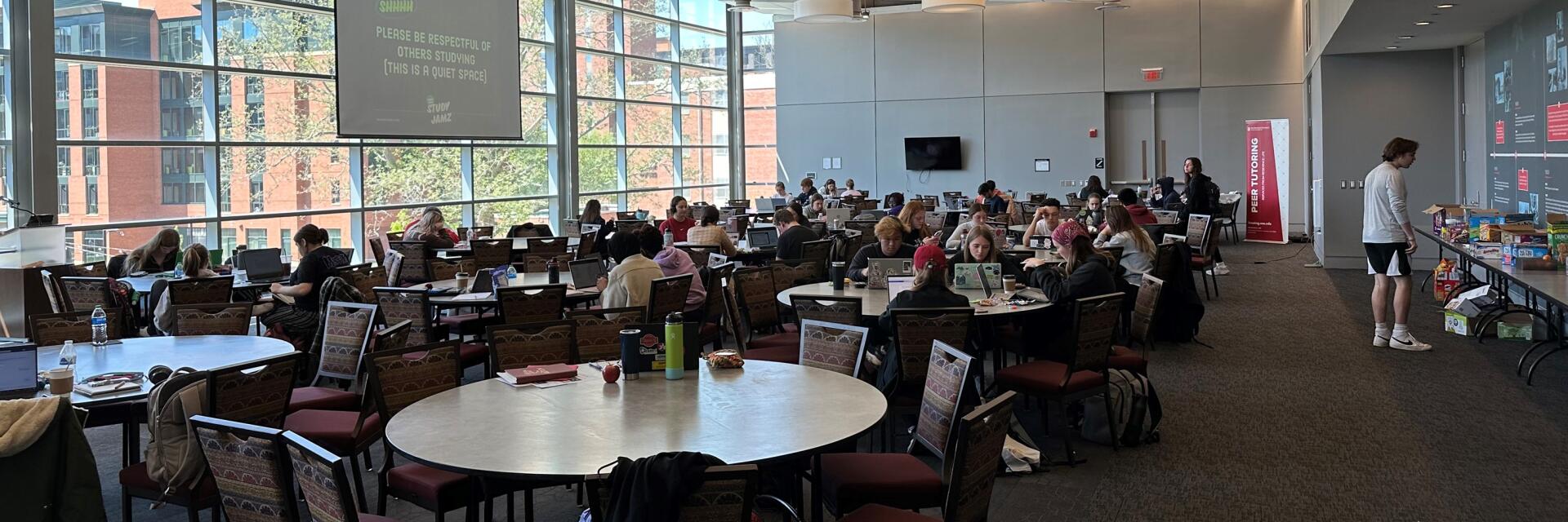 people sitting at tables during Study Jamz event