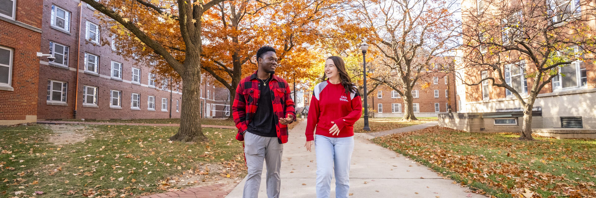 Two Ohio State students walking along the Oak Walk on North Campus.